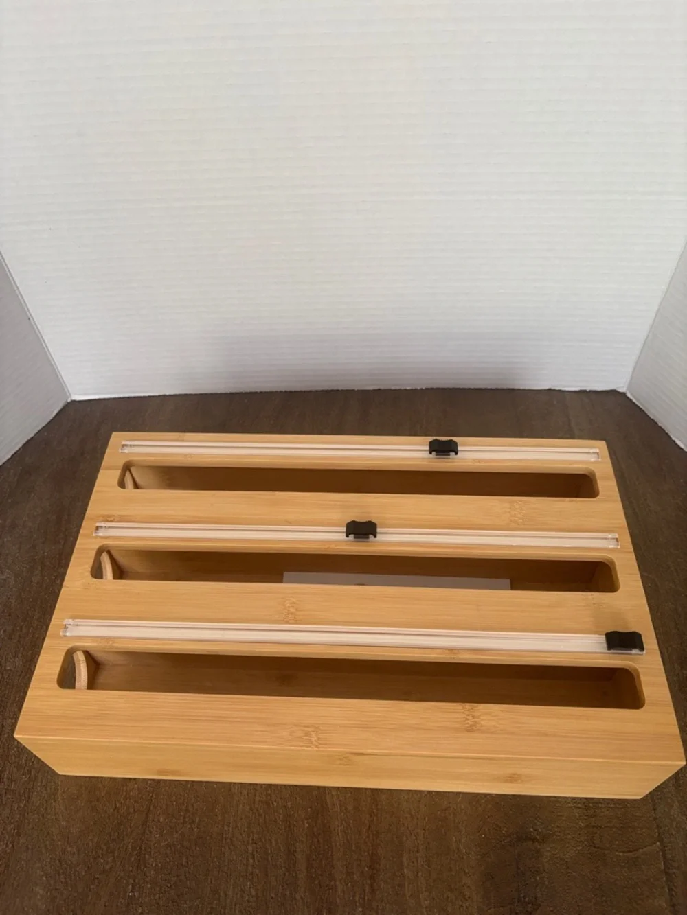 3-in-1 bamboo plastic wrap, aluminum foil, and parchment paper dispenser.